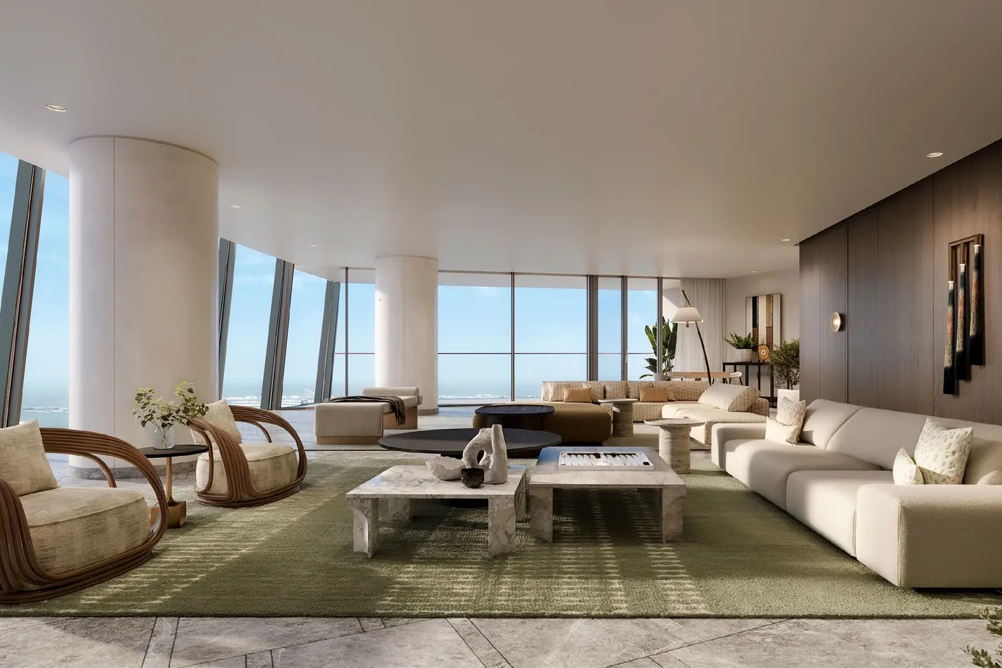 Wide living room with curved glass walls overlooking the sea