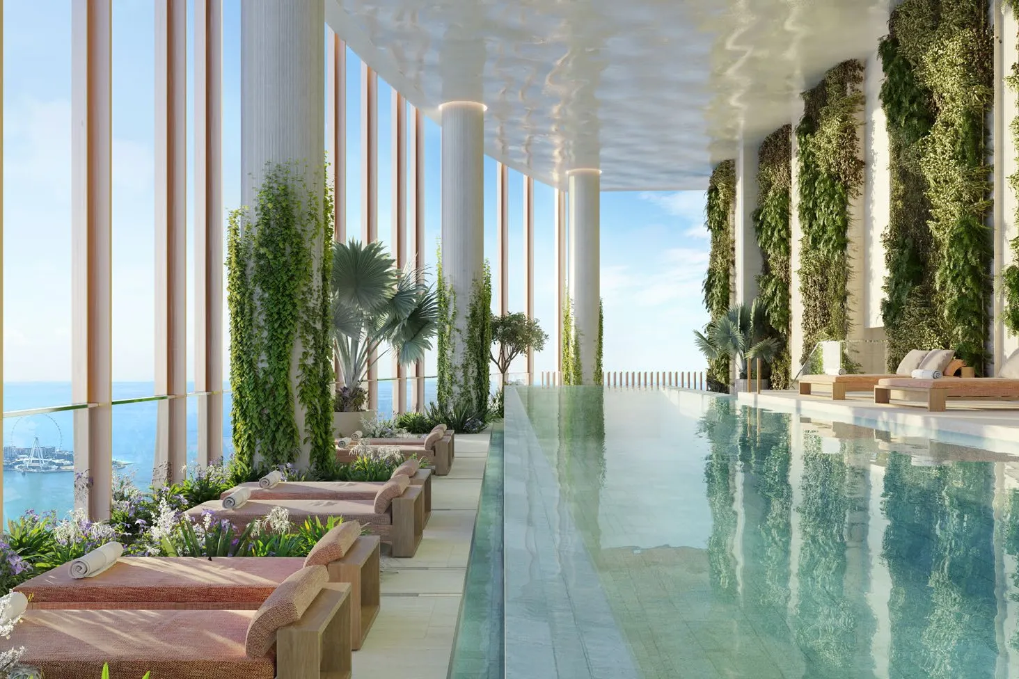 Lap pool on Level 109 with green walls, loungers and Ain Dubai view